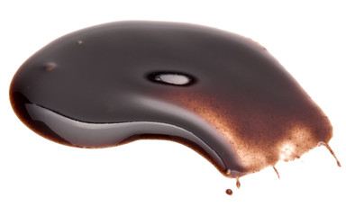 Chocolate syrup drop isolated on white background