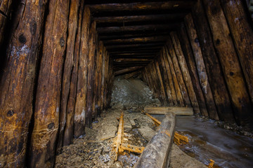 Old abandoned underground ore mica  mine shaft tunnel