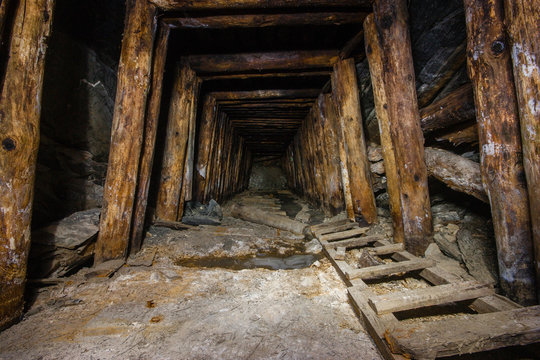 Old abandoned underground ore mica  mine shaft tunnel