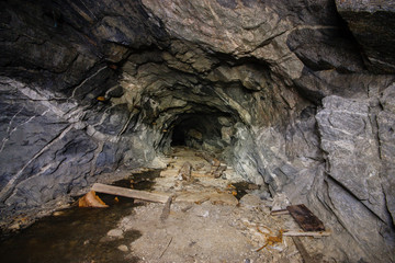 Old abandoned underground ore mica  mine shaft tunnel