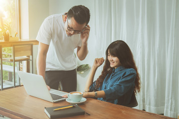 Business online concept. Asian friends meeting and having fun at coffee shop.