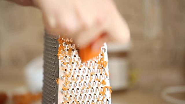 Carrot grating on metal grater 