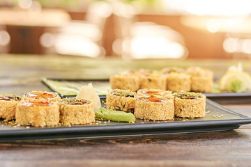 Set of unagi sushi rolls, blurred background. Sushi roll in restaurant. Traditional japanese food.