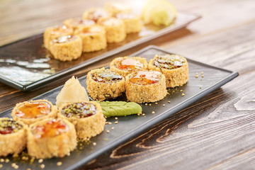 Traditional japanese food on plate. Japanese food roll with fish and avocado. Sushi menu in restaurant.