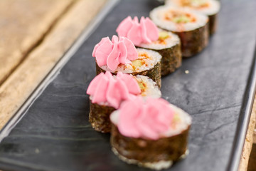 Appetizing japanese sushi tokobana. Japanese susi roll on traditional japanese plate. Delicious japanese food.