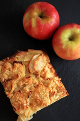 Fresh homemade Apple Pie with Apple on black background top view