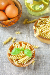 Helix- or corkscrew-shaped pasta. Rotini macaroni. Related to fusilli, but has a tighter helix, i.e. with a smaller pitch