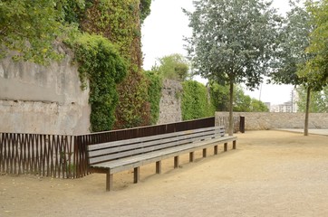 Long wooden bench in Girona, Spain