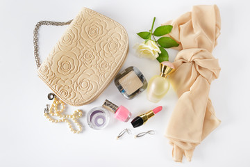 Cosmetics, perfumes, jewelry made of pearls and handbag