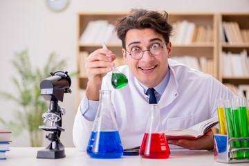 Mad crazy scientist doctor doing experiments in a laboratory