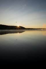 Landscape at Dawn with Still Water, Sunrise, Hill and Flying Bird