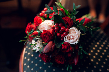 Classic wedding bouquet with red flowers and decoration