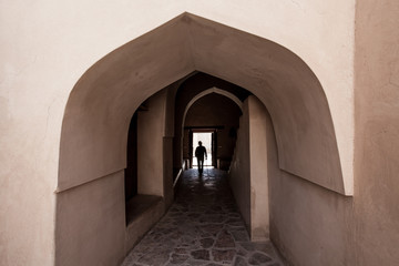 Man silhouetted in tunnel