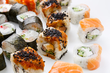 Closeup set of sushi rolls, maki on white background