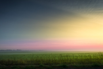 Sunrise over farmlands a beautiful summer morning