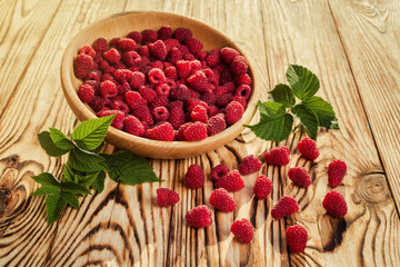 raspberries in a plate,in wooden bowl,basket/bush branch/growing raspberries,raspberries background closeup photo,high resolution product,Delicious first class organic fruit,Raspberry as background