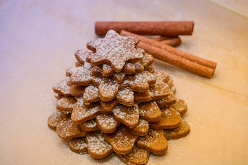 Christmas tree made from gingerbread cookies dough, cinnamon and bakery tools. New year, Christmas, winter and cooking background