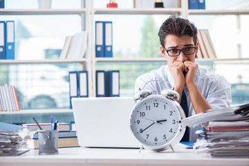 Businessman missing deadline for deliverables in office