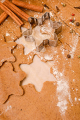 Homemade gingerbread cookies dough, cinnamon and bakery tools. New year, Christmas, winter and cooking background