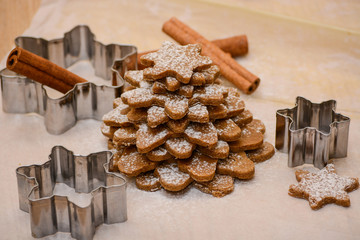 Christmas tree made from gingerbread cookies dough, cinnamon and bakery tools. New year, Christmas, winter and cooking background