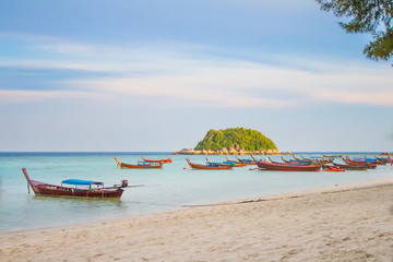 Fototapeta na wymiar Longtail boat parking at Lipe island, Satun Province, Thailand