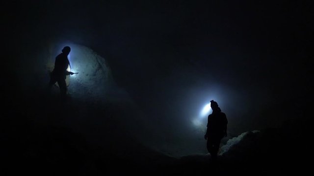 Sulfur miners at Ijen volcano in the night. Kawah Ijen volcano in East Java, Indonesia.