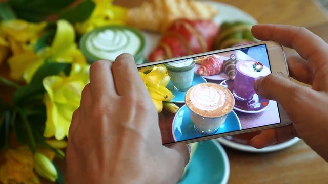 Female Hands Photographing Colorful Coffee With Smartphone. Closeup. 4K. 