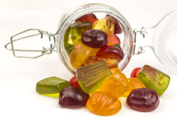 fruity gummy candies in a glass jar