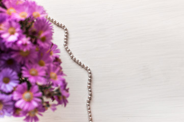 flat lay beauty flowers and beads