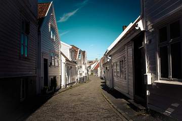 Fototapeta na wymiar narrow street that runs through the old Stavanger district