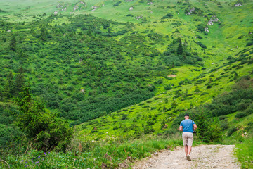 The guy goes along the mountain road