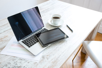 Tablet PC and a Laptop PC on an office desktop