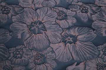 dark fabric with floral embossed pattern