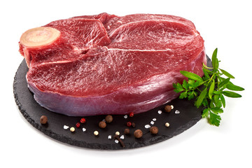 Fresh raw beef meat with bone for steak on stone plate, isolated on white background
