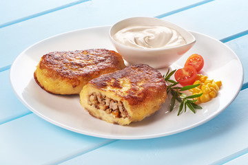 Potato pancakes with meat with sour cream