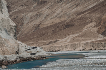 Landscape image of the blue Shyok river on the way to Nubra valley , Ladakh India