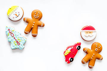 Gingerbread cookies of different shapes on white background top view copyspace