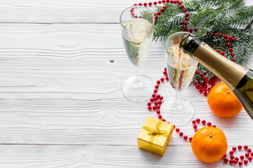 Glasses of champagne and new year decoration on grey wooden background copyspace