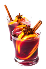 Hot mulled wine for winter with spices isolated on white background,