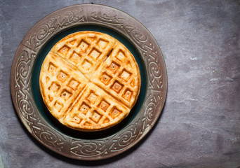 Traditional Scandinavian style waffles served on a rustic plate.