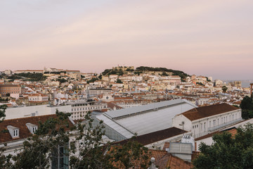 Beautiful view on a pink sunset Lisbon from a viewpoint 