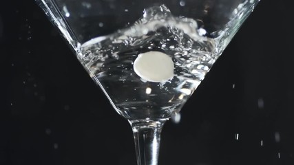 Olive falls into a glass with martini in slow motion, 240 frames per second, coctail with alcohol, slow motion food video - Powered by Adobe
