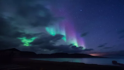 Fotobehang The polar arctic Northern lights aurora borealis sky star in Norway Svalbard in Longyearbyen the moon mountains © bublik_polina