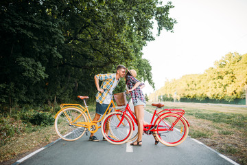 Fototapeta premium Love couple with vintage bicycle walking in park