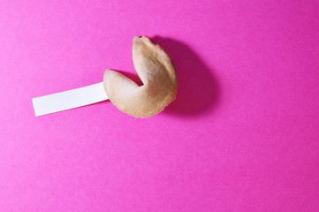 fortune cookie in pink background