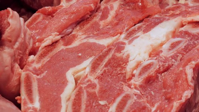 Fresh pink and delicious beef meat with white streaks macro close-up view