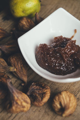 Figs and fig jam in a white bowl