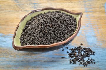 black cumin seeds in a leaf bowl