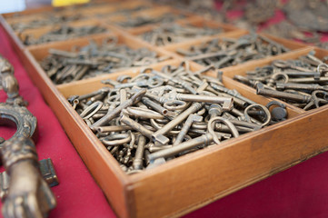 Close up of old keys in wooden display