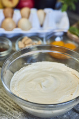A beautiful rich and creamy , white whipped meringue mixture in a large mixing bowl.